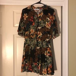 A cute button up multi colored mini dress